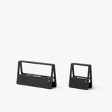 Two modern, minimalist black staple removers in different sizes sit side by side on a plain white background—a sleek addition to any desk organizer paired with your HMM Clips (Set of 2 - Black).