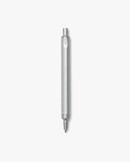 The HMM Ballpoint Pen (Raw), featuring a sleek aluminum body with a hexagonal barrel and a click-top mechanism, is displayed vertically against a plain white background.