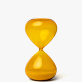 The 25 Minute Hourglass (Amber) is a hand-blown glass timer with amber sand, standing upright on a plain white background—ideal for precise 25-minute Pomodoro sessions.