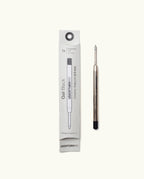 A Black Gel Pen Refill (The Ugmonk Pen) is shown beside its white rectangular box, which features black text and a line illustration of the black gel refill.