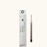 A Black Gel Pen Refill (The Ugmonk Pen) is shown beside its white rectangular box, which features black text and a line illustration of the black gel refill.