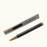 The Ugmonk Pen (Leuchtturm1917 Drehgriffel - Black) is shown alongside its gray and gold "UGMONK" box, both arranged neatly on a plain white background.