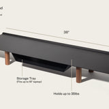 The Gather Large Monitor Stand (Black/Walnut) features solid wood legs, a powder-coated steel surface, a built-in storage tray for up to a 16" laptop, measures 38 x 10.5 x 5", and supports up to 35 lbs.