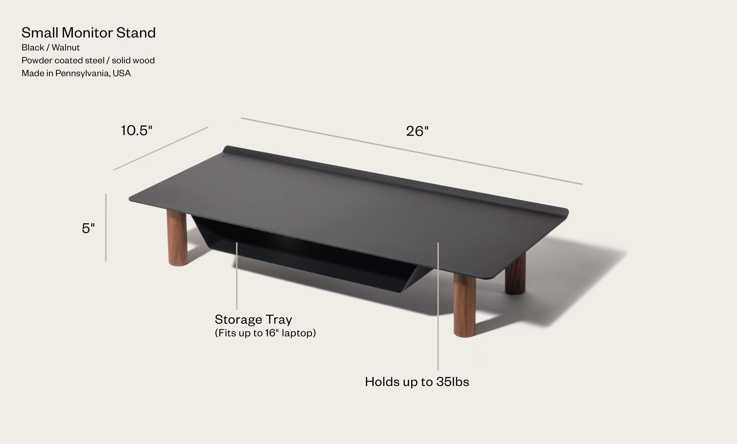 The Gather Small Monitor Stand (Black/Walnut) features four wooden legs, a powder-coated steel top, a tray for up to a 16" laptop, measures 26 x 10.5 x 5 inches, and supports up to 35 lbs.