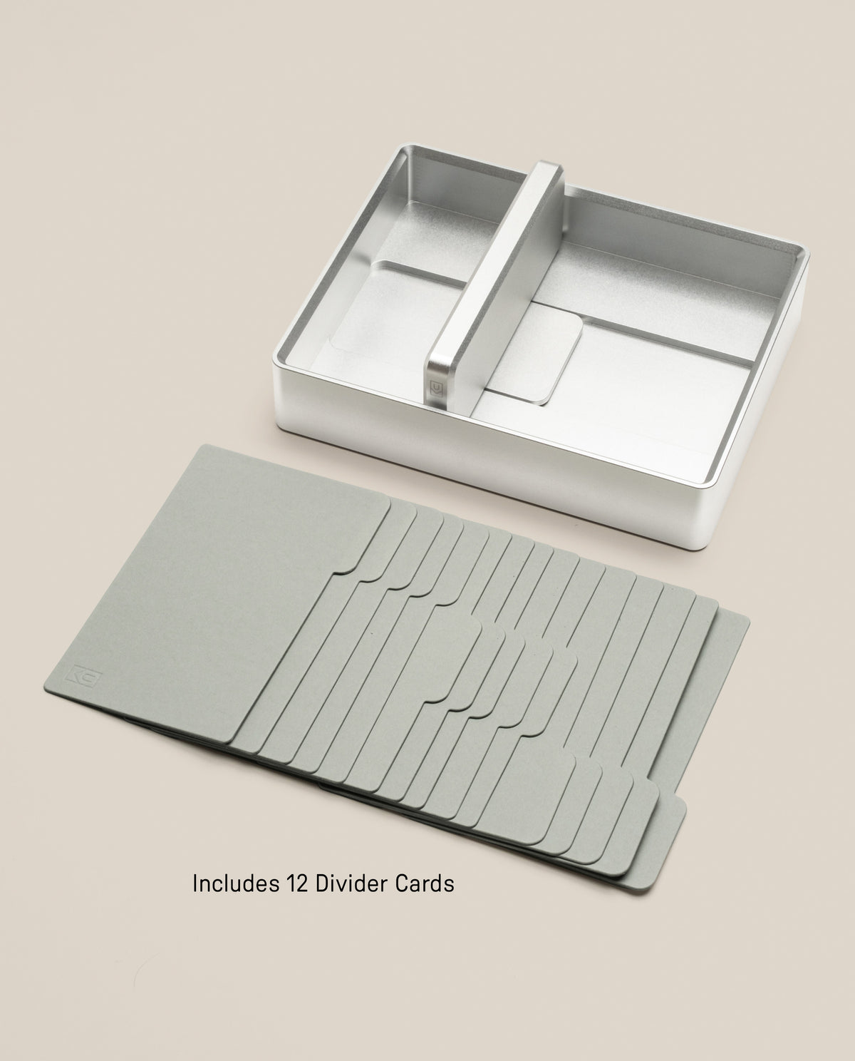 Analog Archive (Silver Aluminum) card holder with a center divider, accompanied by a set of twelve gray divider cards for desk card archiving.