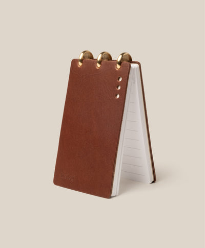 The Leather Discbound Analog (Brown) is a compact flip notebook with a full-grain leather cover, gold discs at the top, and lined pages—ideal for jotting notes or using as Analog Task Cards.