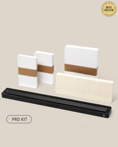 The Analog Card Bar - Pro Kit (Black), a minimalist stationery set featuring planners, notepads, Task Cards, and a desk organizer, is shown on a light beige background with “BEST SELLER” and “PRO KIT” labels in the corner.