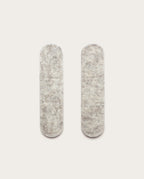 Two light gray, oval-shaped Warehouse Item - Magnetic Cable Keepers (Set of 2 - Light Gray) are placed vertically side by side on a plain white background.