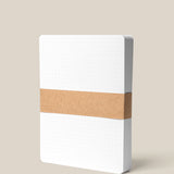 The Analog Dot Grid Cards - Large (1-Pack) features premium white dot grid cards, bound by a brown kraft paper band and shown standing upright against a plain beige background.