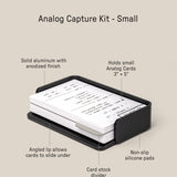The Analog Capture Kit - Small (Black Aluminum) is a compact tray with Small Dot Grid Cards in a sturdy aluminum holder, featuring an angled lip, card stock divider, non-slip silicone pads, and text labels. Size: 5.31 × 3.4 × 1.23 inches.