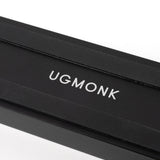 A sleek black rectangular box with "UGMONK" in white capitals on the lid, ideal for storing the Analog Card Bar (Small 10" - Black), photographed against a white background.