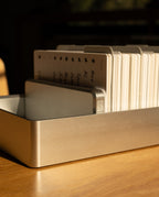 An Analog Archive (Silver Aluminum) card holder containing a stack of indexed cards.