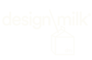White outline drawing of a milk carton with a straw and the word design milk above it, all set against a very light gray background. The letters dm appear on the side of the carton.
