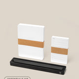 The Analog Card Bar - Essentials Kit (Black Aluminum) includes a large dotted notepad, a to-do list notepad, and a sleek black pen holder on a light beige background—modern essentials for any desk.