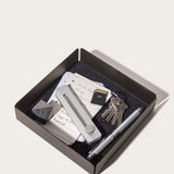 The Gather Large Tray (2x2 - Black) features a spacious, felt-like surface with a magnetic bottom, and holds items such as cards, a metal tool, a stone, an SD card, keyring keys, and two silver pens.