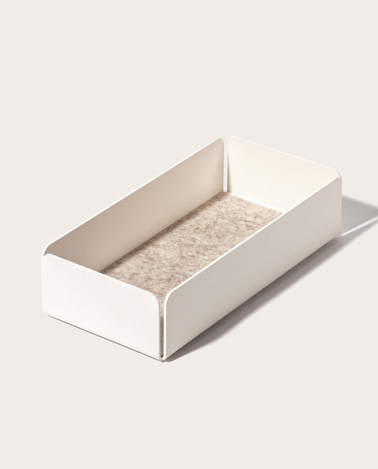 The Gather Medium Tray (2x1 - White) is a minimalist valet tray, crafted in Pennsylvania with rectangular powder-coated steel sides and a textured beige base, shown on a light background.