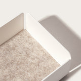 The Gather Medium Tray (2x1 - White) features a minimalistic white powder-coated steel design with raised sides and a beige textured felt base, casting a gentle shadow on a light surface.