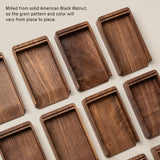 Several Analog Daily Focus Kit (Walnut) trays made from solid American Black Walnut are arranged on a light surface, displaying unique grain patterns; ideal as wooden card holders for task cards in an analog productivity system.