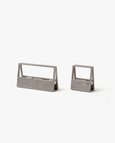 The HMM Clips (Set of 2 - Raw) feature sleek, open-frame aluminum designs—one large and one small—resting on a white background. Ideal as modern organizers for your workspace or stylish paper clips.