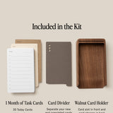 The Analog Daily Focus Kit (Walnut) includes white and brown task cards for 1 month, a gray card divider, and a walnut holder with front slot and back storage.