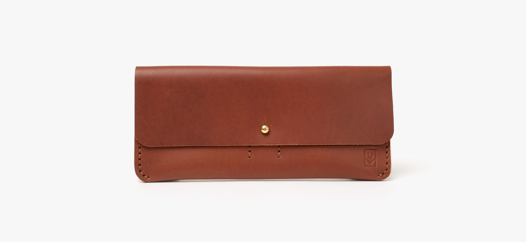 A brown leather pencil case with visible stitching and a single gold button closure, displayed against a plain white background.