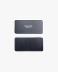 Two rectangular black leather labels are shown on a plain white background. The top label, intended for the Warehouse Item - Magnet Kit (For Analog Card Holder), features "UGMONK Made in USA" printed in white; the bottom label is blank.