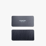 Two black rectangular leather tags for the Magnet Kit (For Analog Card Holder) are shown on a white background. The top tag displays "UGMONK Made in USA" in white, while the bottom tag is plain with no text or markings.