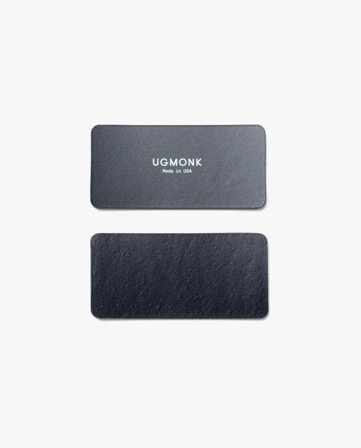 Two black rectangular leather tags for the Magnet Kit (For Analog Card Holder) are shown on a white background. The top tag displays "UGMONK Made in USA" in white, while the bottom tag is plain with no text or markings.
