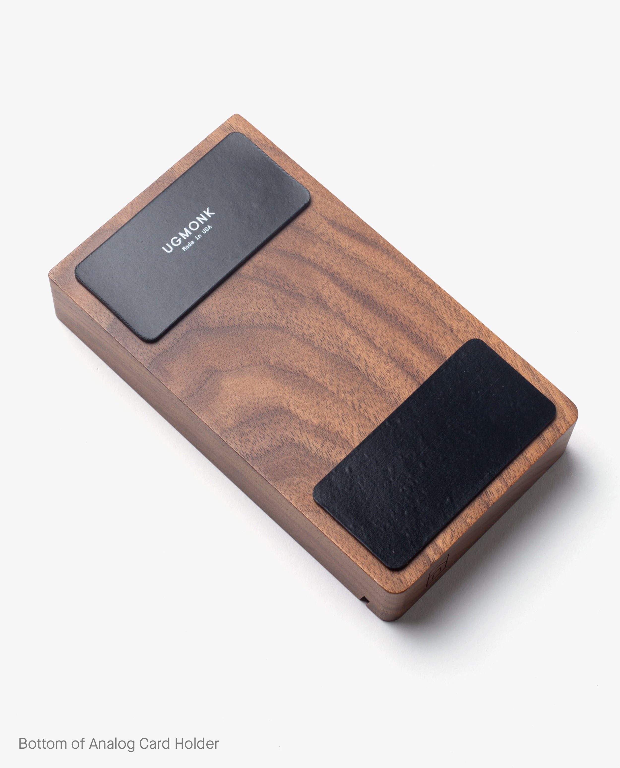 Warehouse Item - Magnet Kit (For Analog Card Holder) shown on a white background, including rectangular wooden Analog Card Holder with two black pads—one featuring white UGMONK branding—and built-in magnets to securely hold cards in place.