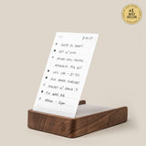 The Analog Daily Focus Kit (Walnut) holds a handwritten to-do list card with bullet-pointed tasks for elegant, analog productivity. A gold #1 Best Seller badge appears in the top right on a beige background.