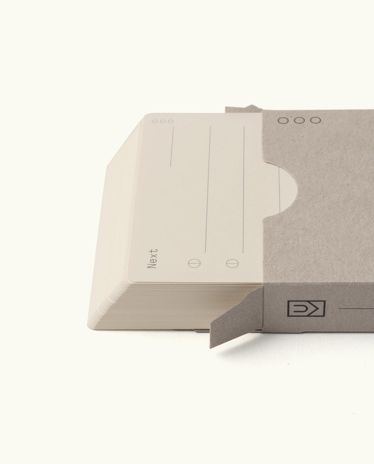 A stack of Analog – Next Cards (1-Pack) partially slides out of a plain, light gray sleeve. The top card features lines and circular checkboxes for goal setting, with a clean white background.