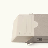 A stack of Analog – Next Cards (1-Pack) partially slides out of a plain, light gray sleeve. The top card features lines and circular checkboxes for goal setting, with a clean white background.