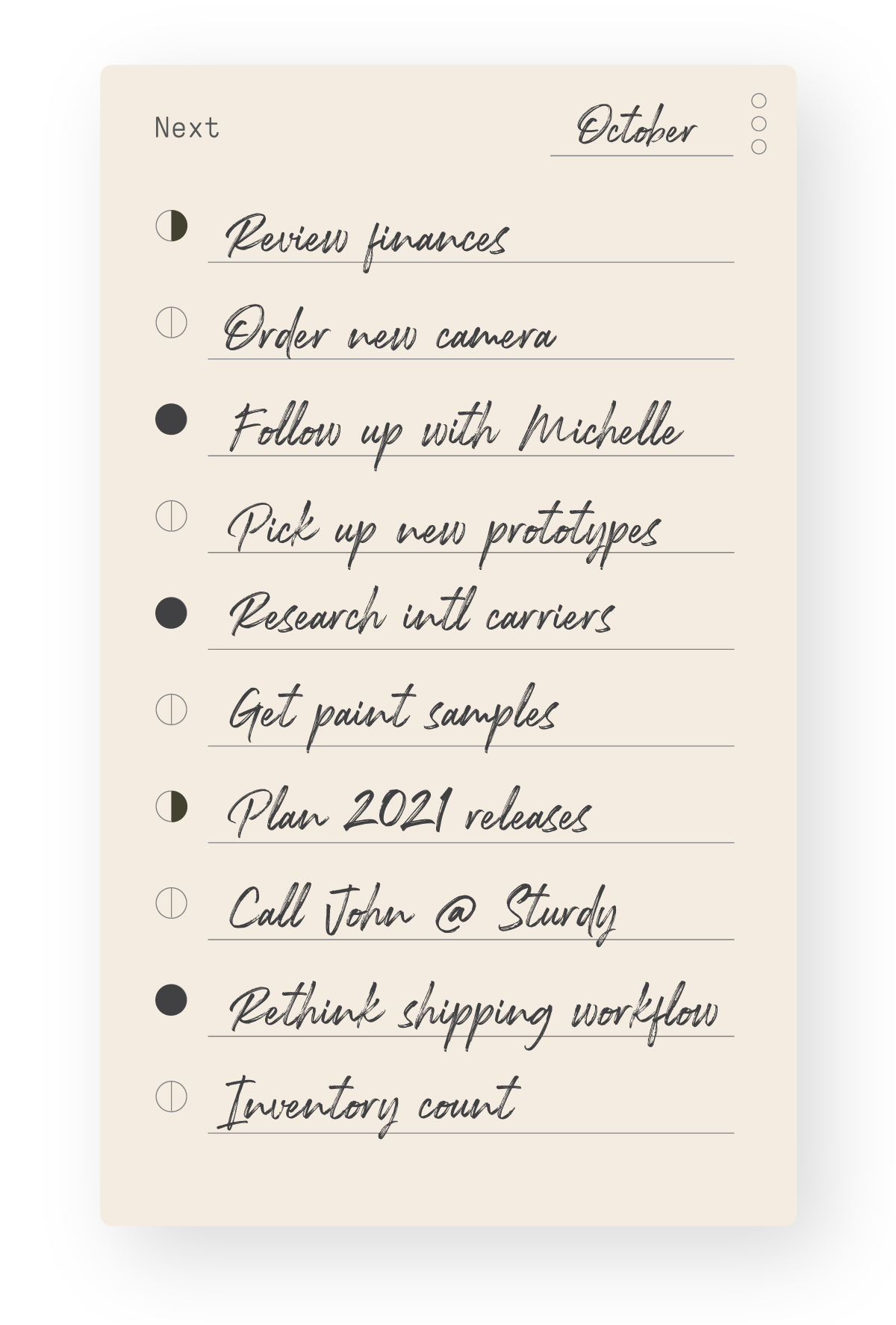 A handwritten to-do list for October with tasks including reviewing finances, ordering a new camera, following up with Michelle, picking up prototypes, and more, on a notepad titled Next.