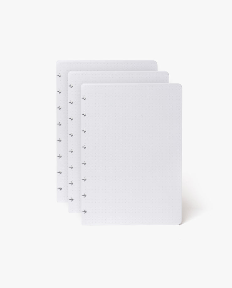 The Discbound Heirloom Journal Bundle includes a black leather 6"x8.5" journal and three white, dotted refill sheets with disc-binding holes—ideal for your refillable notebook or discbound journal.