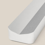 A close-up of the Analog Pen Tray in silver aluminum—a sleek, rectangular tray with a beveled edge—crafted from solid aluminum and displayed on a beige background.