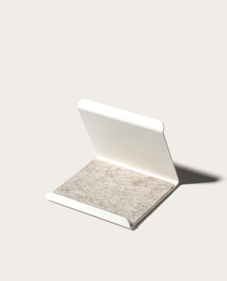 The Gather 2x2 Organizer Set (White) features a minimalistic L-shaped design in powder-coated steel with a textured light gray felt base, shown against a plain, light background.