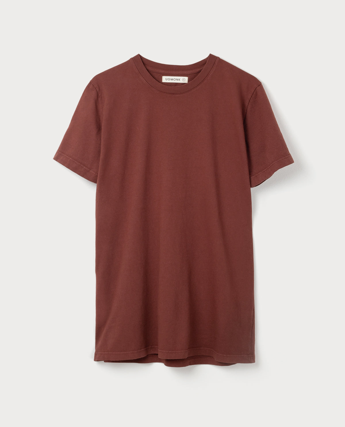 A plain, short-sleeved, crew-neck t-shirt in a solid brown color is displayed against a white background.
