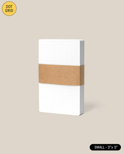 The Analog Dot Grid Cards - Small (1-Pack) are shown upright against a beige background, bound by a brown paper band. A yellow circle highlights "DOT GRID—perfect for analog note taking.