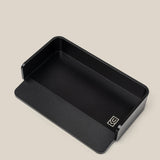 The Analog Capture Kit - Small (Black Aluminum) is a black rectangular aluminum card tray with rounded corners, a low front edge, and a small white geometric logo—ideal for organizing your Small Dot Grid Cards against any backdrop.