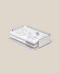 The Analog Capture Kit - Small (Silver Aluminum) features white dot grid cards with black handwritten notes and drawings, neatly arranged in a sleek silver aluminum tray on a plain beige background.