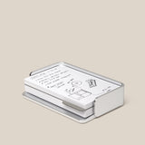 The Analog Capture Kit - Small (Silver Aluminum) features white dot grid cards with black handwritten notes and drawings, neatly arranged in a sleek silver aluminum tray on a plain beige background.