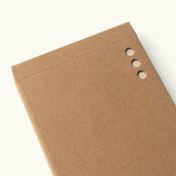 The Analog - Someday Cards (3-Pack) features brown cardboard notebooks with plain uncoated paper cards and three round holes punched along the edge, shown closed on a light background with no writing or decoration.