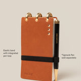 Brown notebook with elastic band and pen loop, Ugmonk pen included.