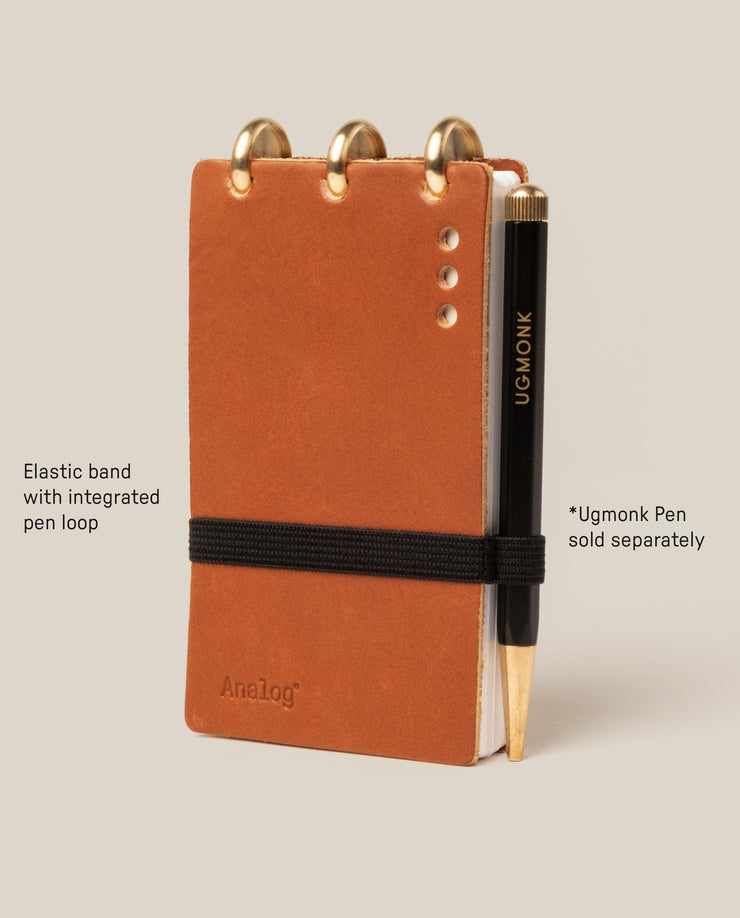Brown notebook with elastic band and pen loop, Ugmonk pen included.