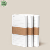 Three stacks of Analog - Task Cards (3-Pack), each wrapped in a brown paper band, sit side by side on a beige background. A green circle in the top left corner displays “TASK CARDS”—ideal for your analog productivity system.