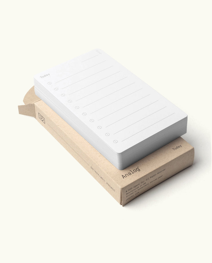 A 3-pack of Analog - Today Cards, featuring white analog cards labeled “Today,” rests atop a simple brown cardboard box against a plain light background.