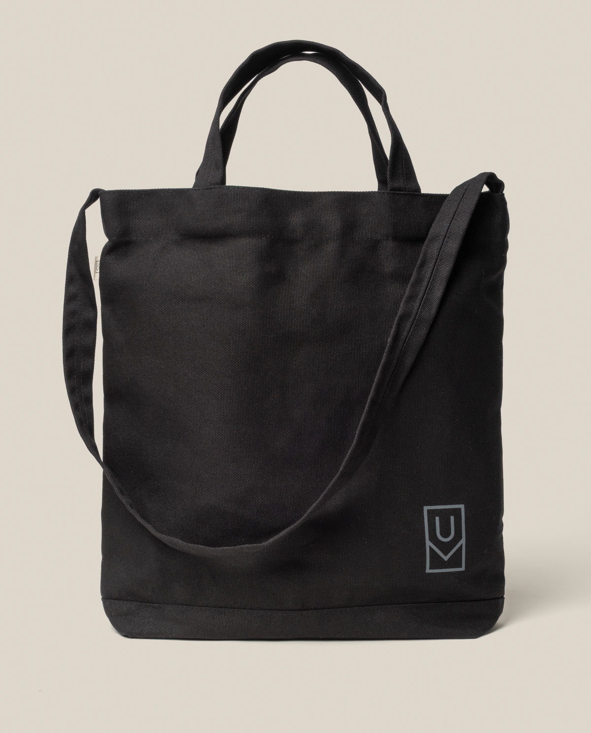 Utility Tote Bundle - Set of 3 black heavyweight cotton tote bag with two handles, a shoulder strap, and a small logo on the front lower right corner.