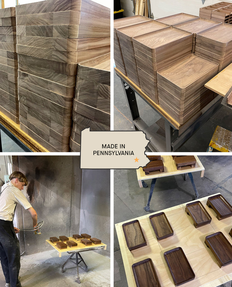 Four images show stacks of small walnut Valet Trays, a worker applying finish, and trays drying. In the center, a graphic of Pennsylvania reads "Made in Pennsylvania," highlighting our handcrafted everyday carry storage.