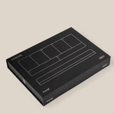 A black rectangular box with white line illustrations and "UGMONK" and "Analog" on the lid, featuring the Analog Weekly Planning Kit (Silver Aluminum), is placed on a plain beige background.