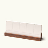 The Analog Weekly Card Holder (Walnut), handcrafted in Pennsylvania, displays blank white cards labeled with days of the week. “*Weekly Analog Cards sold separately” appears in the corner.